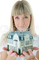 architect woman with little house on hand
