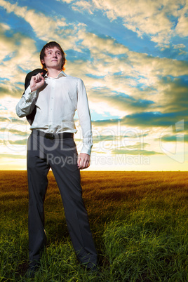 young businessman in field