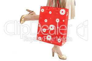 woman legs with packet run shopping