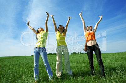 three girlfriend in green field