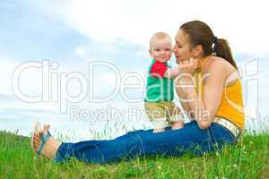 Mother with  baby  on the meadow