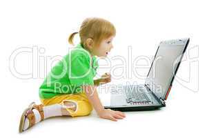 child with laptop show finger in screen