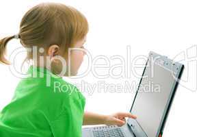 child with laptop show finger in screen