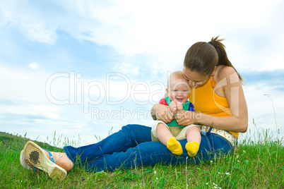 Mother with  baby  on the meadow