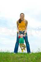 Mother with  baby  on the meadow