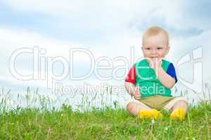 liitle baby sit on grass