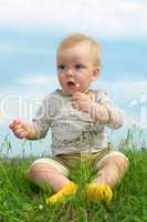 little baby  on green grass