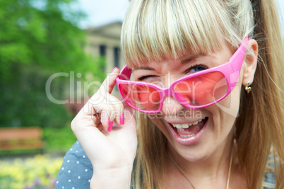 woman in pink glasses