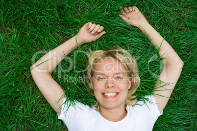 beauty happy woman lie on grass