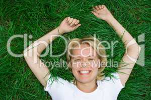 beauty happy woman lie on grass