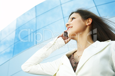 beautiful  business woman on the phone at modern building