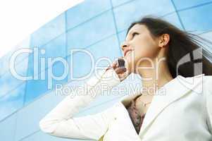 beautiful  business woman on the phone at modern building