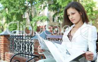 woman reading the newspaper