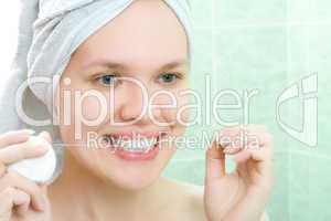 young beauty woman clean teeth thread in bath room
