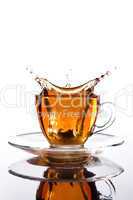 glass cup of tea withsplash out