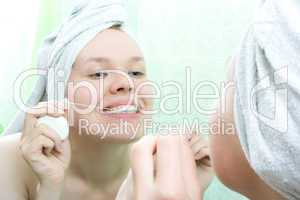 young beauty woman clean teeth thread