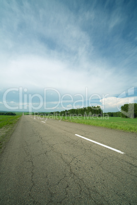 asphalt road in field