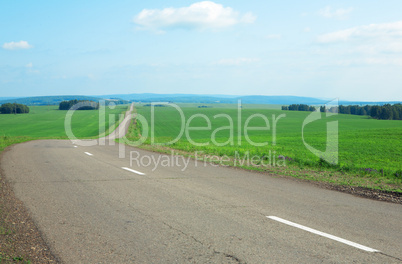 road, clouds and the blue sky