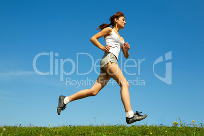 woman run on green grass