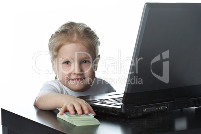 little girl with laptop and money
