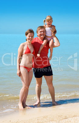 young family on the beach