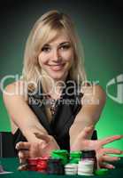 Poker player in casino with cards and chip