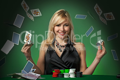 Poker player in casino with cards and chipsv