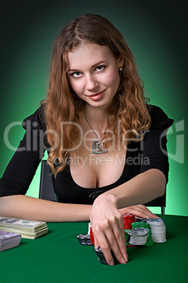 Poker player in casino with cards and chipsv