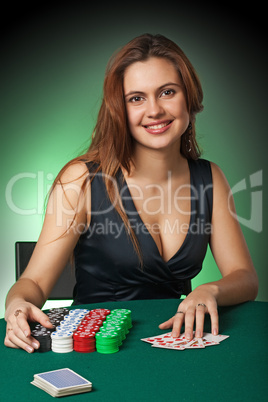 Poker player in casino with cards and chips