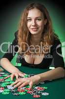 Poker player in casino with cards and chips