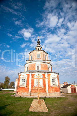 Wooden cross against a church