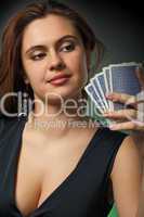 Poker player in casino with cards and chips