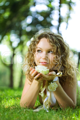 young beauty woman in park with flower