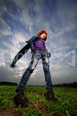 beauty redhaired girl in field