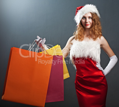 portrait of a  christmas woman in beauty red dress