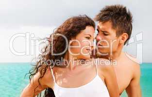 Attractive young couple on the beach