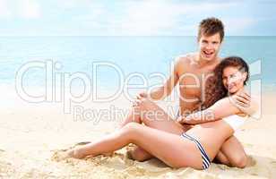 Attractive young couple on the beach