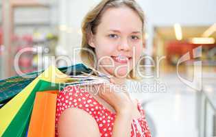 young woman in market with bag