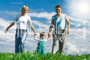 family under blue sky