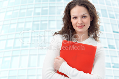 businesswoman on modern glass building