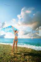 young beauty woman stand on sea beach