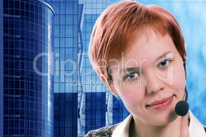 woman operator with headphoneson blue sky and business buildings