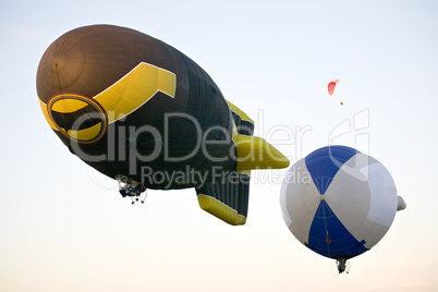 two flying dirigibles