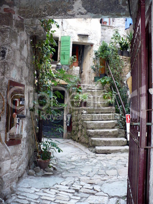 Croatia. Istria. Rovinj. Picturesque courtyard behind a gate