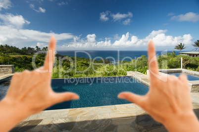 Hands Framing Oceanview Pool and Patio