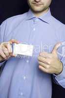 Business man holding blank card. OK