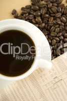 Caffeine Drink & Newspaper