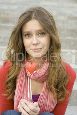 Beautiful girl with a red heart