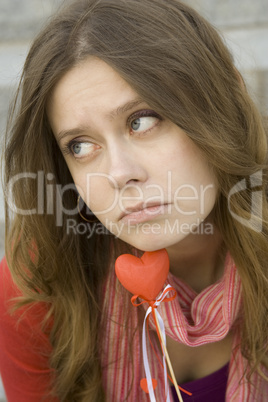 Beautiful girl with a red heart