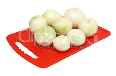 onion on red kitchen board